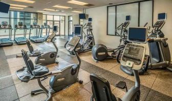 Fitness center with treadmills and machines at the Hilton Salt Lake City Center.