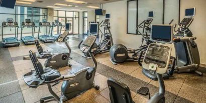 Fitness center with treadmills and machines at the Hilton Salt Lake City Center.