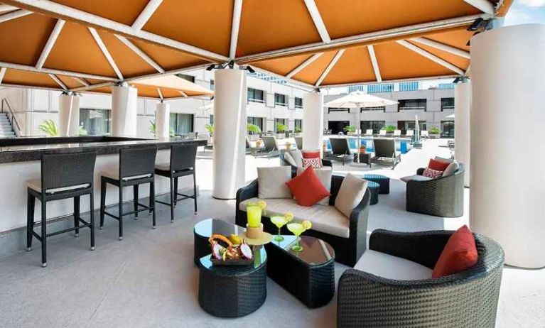 beautiful outdoor lounge and coworking space by the pool at Hilton Houston Post Oak by the Galleria.