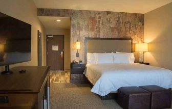 comfortable king bed with TV at Hampton Inn & Suites Murrieta Temecula.