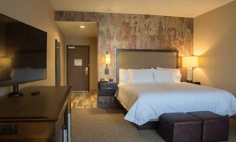 comfortable king bed with TV at Hampton Inn & Suites Murrieta Temecula.