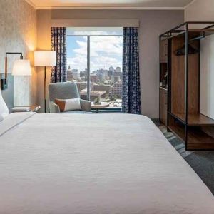 Spacious king suite with business desk and city views at Hilton Garden Inn Austin University.