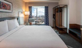 Spacious king suite with business desk and city views at Hilton Garden Inn Austin University.