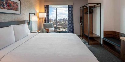 Spacious king suite with business desk and city views at Hilton Garden Inn Austin University.