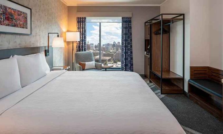 spacious king suite with business desk and city views at Hilton Garden Inn Austin University.