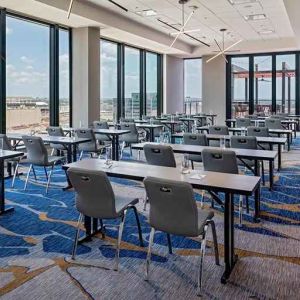 Professional conference room with a lot of natural light and city views at Hilton Garden Inn Austin University.