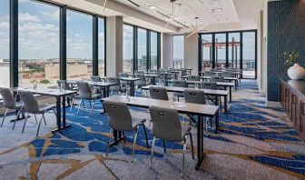 Professional conference room with a lot of natural light and city views at Hilton Garden Inn Austin University.