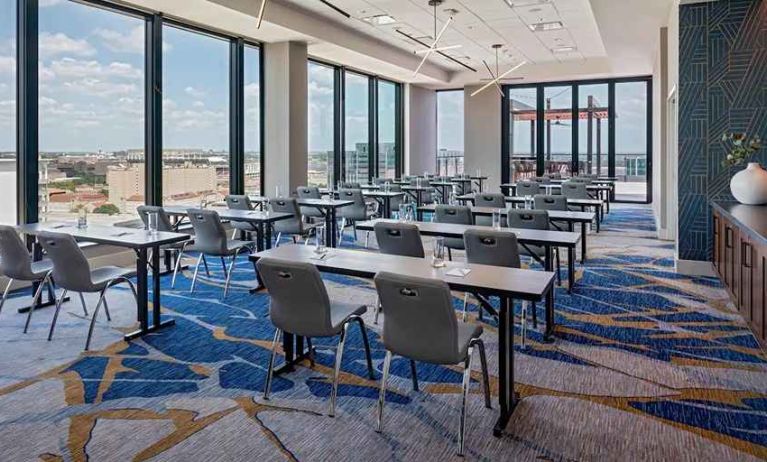 professional conference room with a lot of natural light and city views at Hilton Garden Inn Austin University.