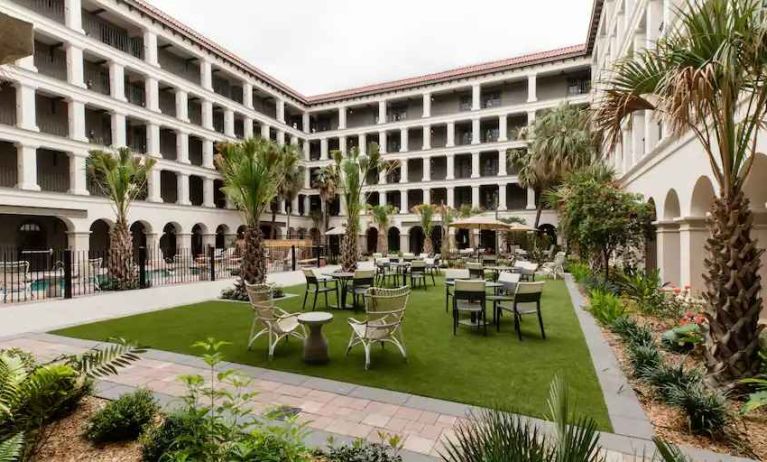 Outdoor workspace with tables and chairs at the Estancia del Norte San Antonio, Tapestry Collection.