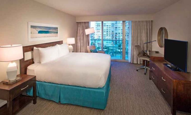 spacious king room with TV and business desk at DoubleTree Resort by Hilton Hollywood Beach.