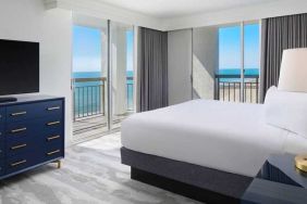 gorgeous king bedroom with sea views at Embassy Suites by Hilton Myrtle Beach Oceanfront Resort.