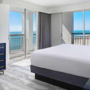 gorgeous king bedroom with sea views at Embassy Suites by Hilton Myrtle Beach Oceanfront Resort.