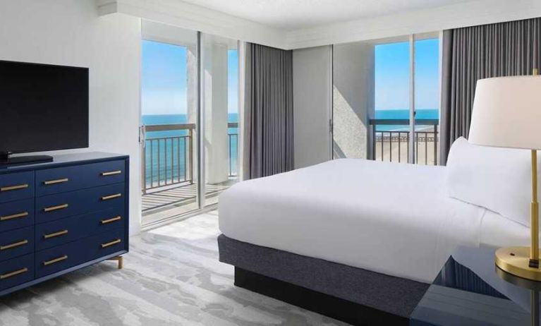 gorgeous king bedroom with sea views at Embassy Suites by Hilton Myrtle Beach Oceanfront Resort.