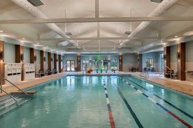 large indoor pool ideal for athletic swimming at Embassy Suites by Hilton Myrtle Beach Oceanfront Resort.