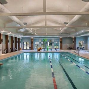 large indoor pool ideal for athletic swimming at Embassy Suites by Hilton Myrtle Beach Oceanfront Resort.