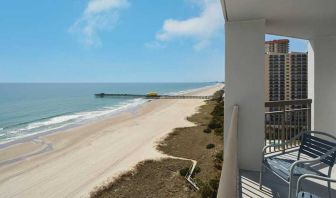 beautiful balcony with sea views ideal for digital nomads to work from at Embassy Suites by Hilton Myrtle Beach Oceanfront Resort.