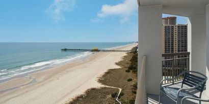 beautiful balcony with sea views ideal for digital nomads to work from at Embassy Suites by Hilton Myrtle Beach Oceanfront Resort.