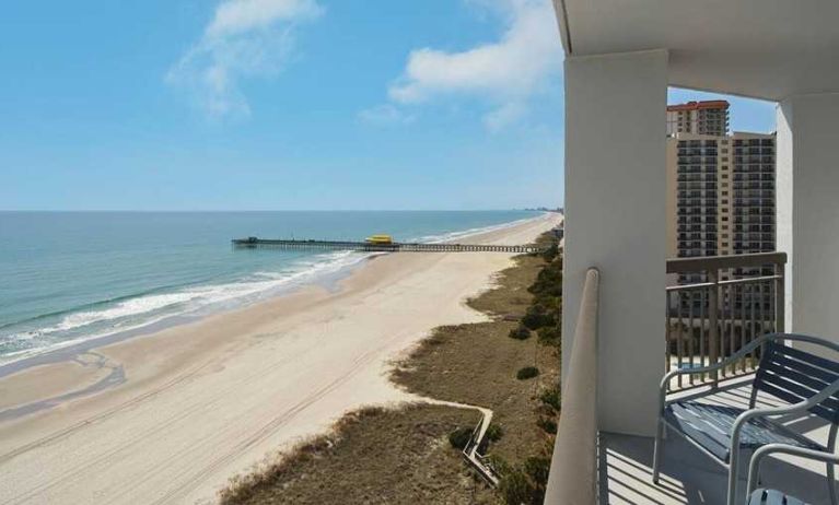 beautiful balcony with sea views ideal for digital nomads to work from at Embassy Suites by Hilton Myrtle Beach Oceanfront Resort.