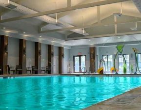 beautiful indoor pool with seating area at Hilton Myrtle Beach Resort.