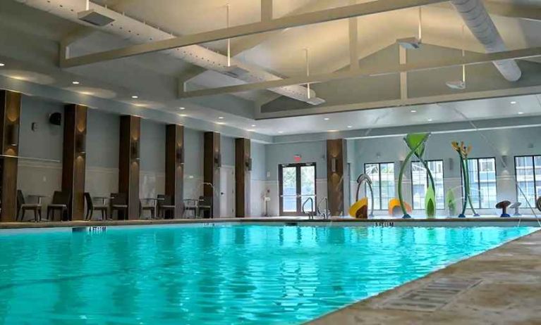 beautiful indoor pool with seating area at Hilton Myrtle Beach Resort.