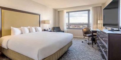 spacious king room with work area and natural light at Washington Hilton.