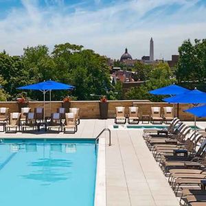 gorgeous outdoor pool with seating and sun beds at Washington Hilton.