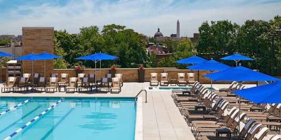 gorgeous outdoor pool with seating and sun beds at Washington Hilton.