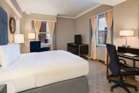 delux king room with TV, work desk, and natural light at Hilton Milwaukee City Center.