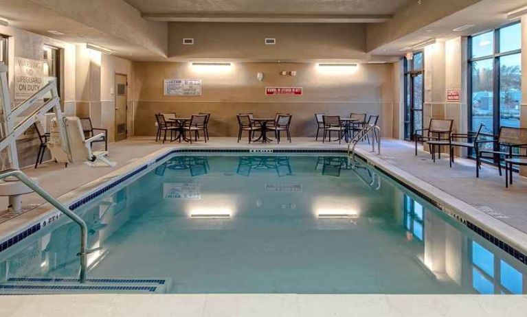 relaxing and accessible indoor pool with seating area at Hampton Inn & Suites San Jose Airport.