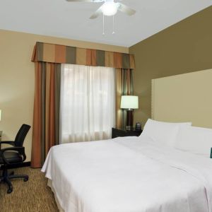 comfortable king delux room full furnished with TV and work desk at Homewood Suites by Hilton Houston-Woodlands.