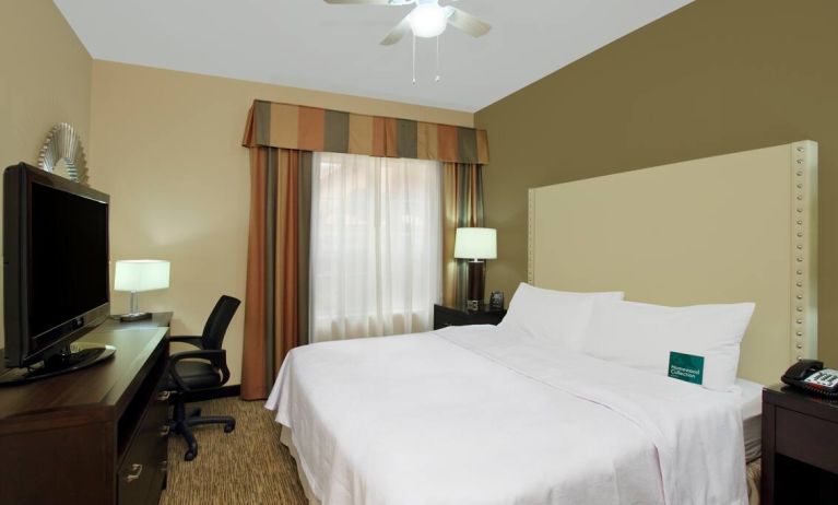 comfortable king delux room full furnished with TV and work desk at Homewood Suites by Hilton Houston-Woodlands.