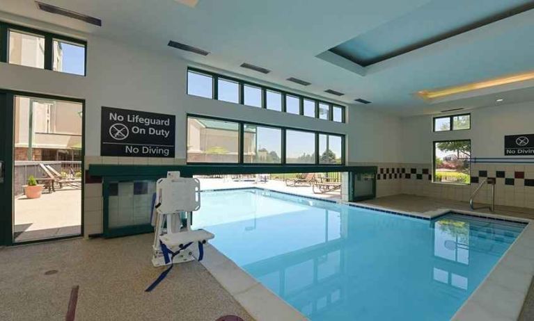 indoor pool with seating and accessible to otherwise-abled guests at Hampton Inn & Suites Pueblo-Southgate.