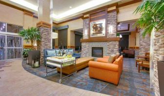 Stylish lobby workspace with fireplace and lounges at the Hilton Garden Inn Fort Worth Medical Center.