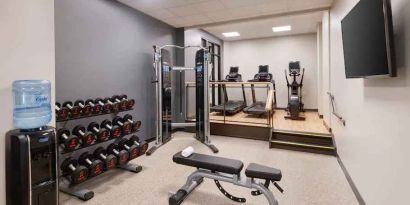 Weights and treadmills at the fitness center of the Embassy Suites by Hilton Tysons Corner.