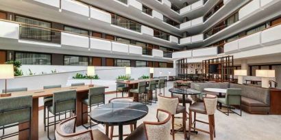 Workspace in a hotel lobby at the Embassy Suites by Hilton Tysons Corner.