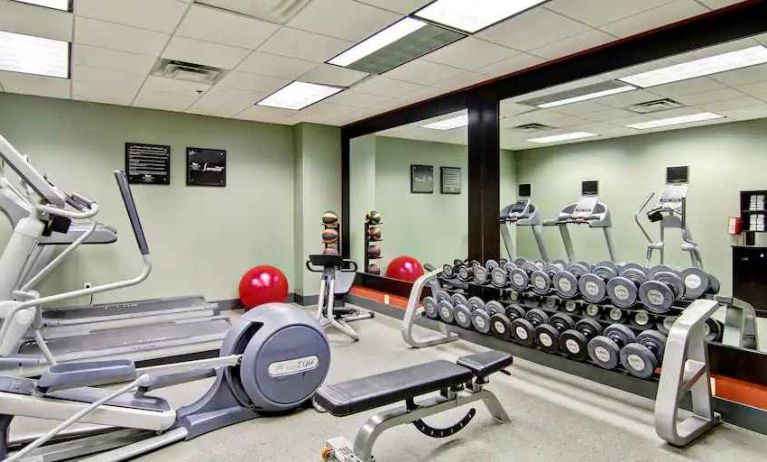 Fitness center with mirrors at the Homewood Suites by Hilton Washington, D.C. Downtown.