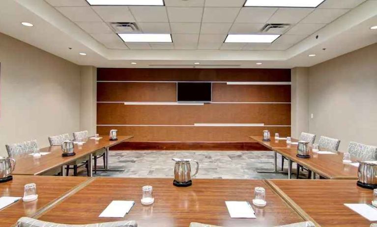 Elegant meeting room with screen at the Homewood Suites by Hilton Washington, D.C. Downtown.