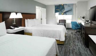 Double queen room with working station at the Hampton Inn & Suites Memphis-Beale Street.