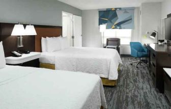 Double queen room with working station at the Hampton Inn & Suites Memphis-Beale Street.