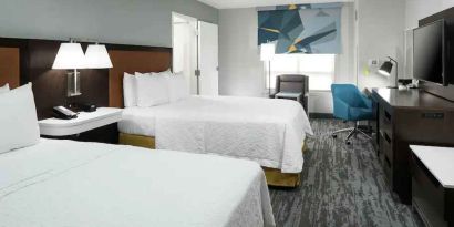 Double queen room with working station at the Hampton Inn & Suites Memphis-Beale Street.