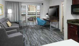 Living room with working station in a hotel suite at the Hampton Inn & Suites Memphis-Beale Street.