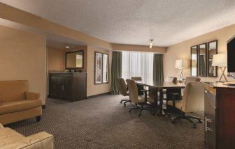 Living room with working station at the Embassy Suites by Hilton Birmingham.