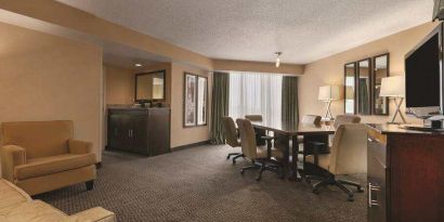 Living room with working station at the Embassy Suites by Hilton Birmingham.