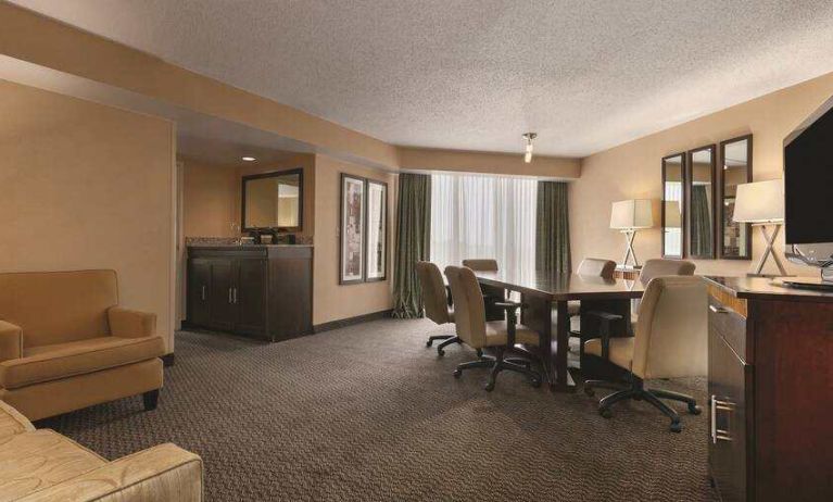 Living room with working station at the Embassy Suites by Hilton Birmingham.