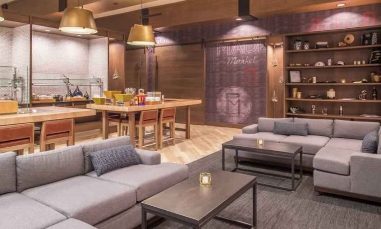 Dining area with tables and chairs at the DoubleTree by Hilton Lafayette East.