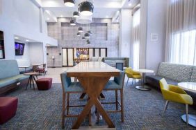 Hotel lobby with sofas, tables and chairs at the Hampton Inn & Suites North Attleboro.