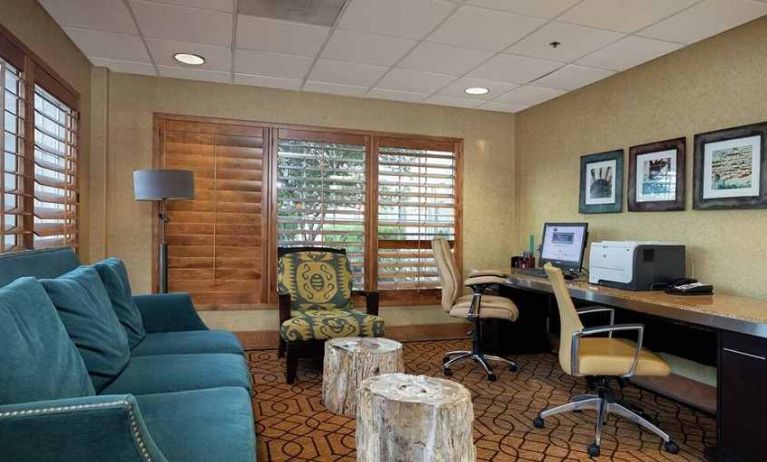 fully-equipped business center with work desk, printers, and internet access at Hampton Inn & Suites Austin-Airport.