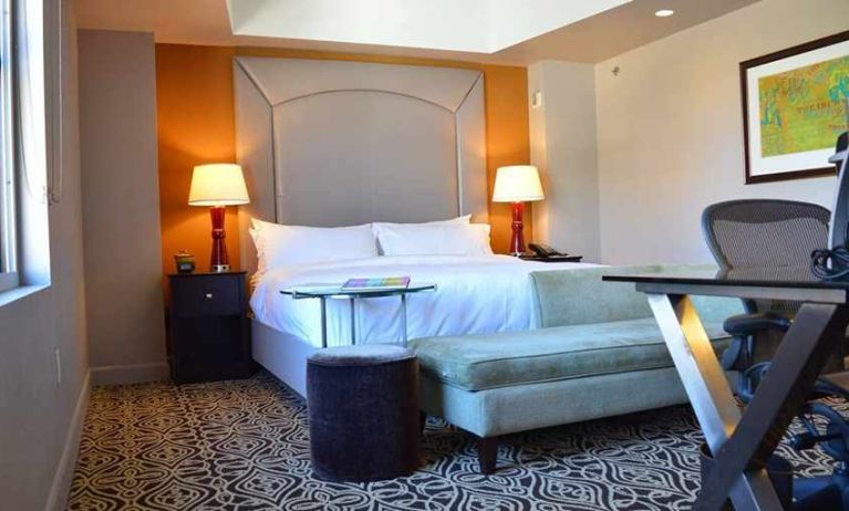 luxurious king room with work area at The Sam Houston, Curio Collection by Hilton.