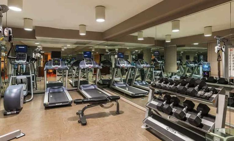 well-equipped fitness center at The Sam Houston, Curio Collection by Hilton.