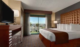 spacious king room with TV and work space at Embassy Suites by Hilton Los Angeles International Airport South.